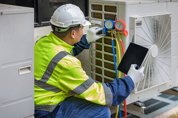 Professional Heat Pump Repair technician working in Rossville, MD